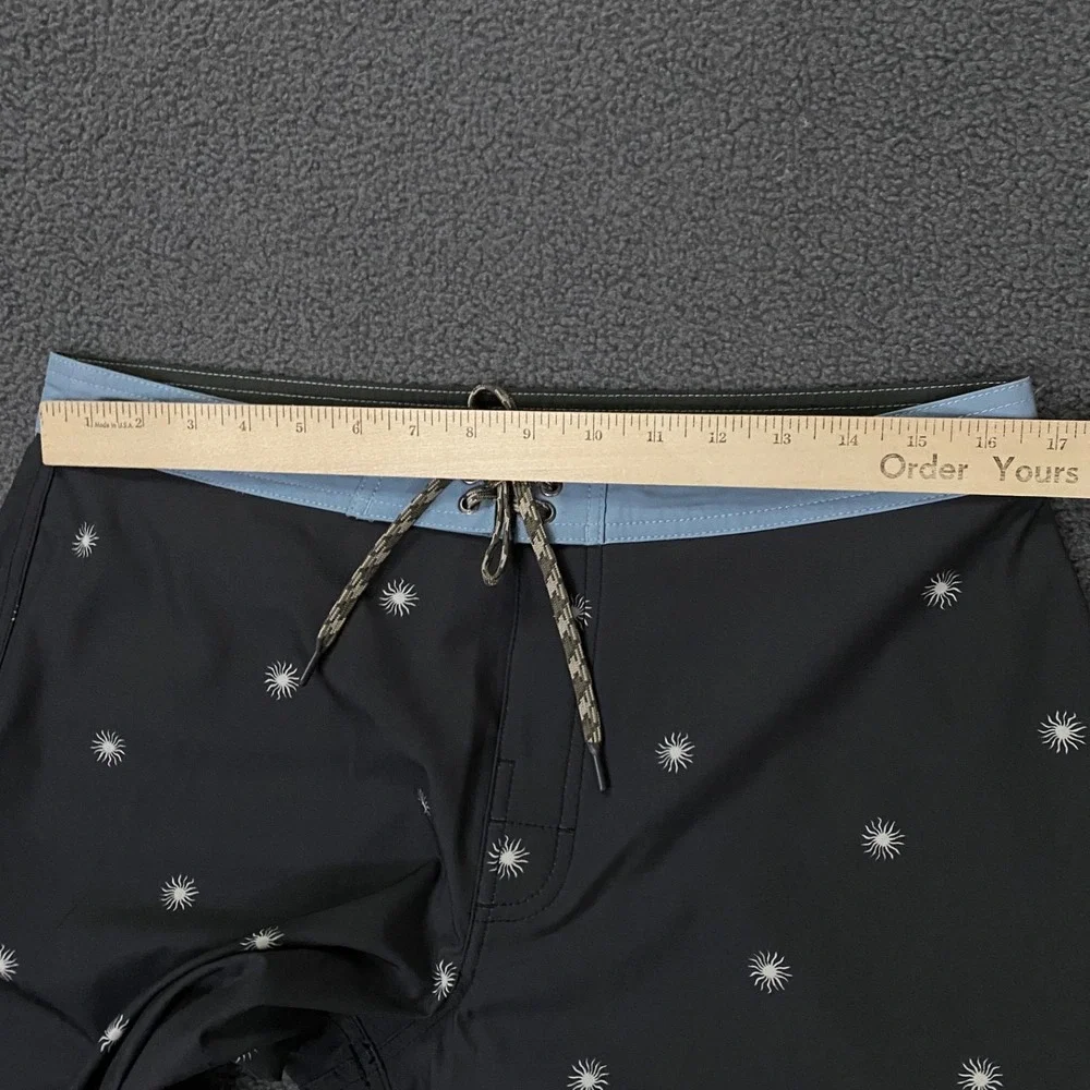 NWOT Katin Black Swim Hybrids with Light Blue Waistband & White Starburst Print